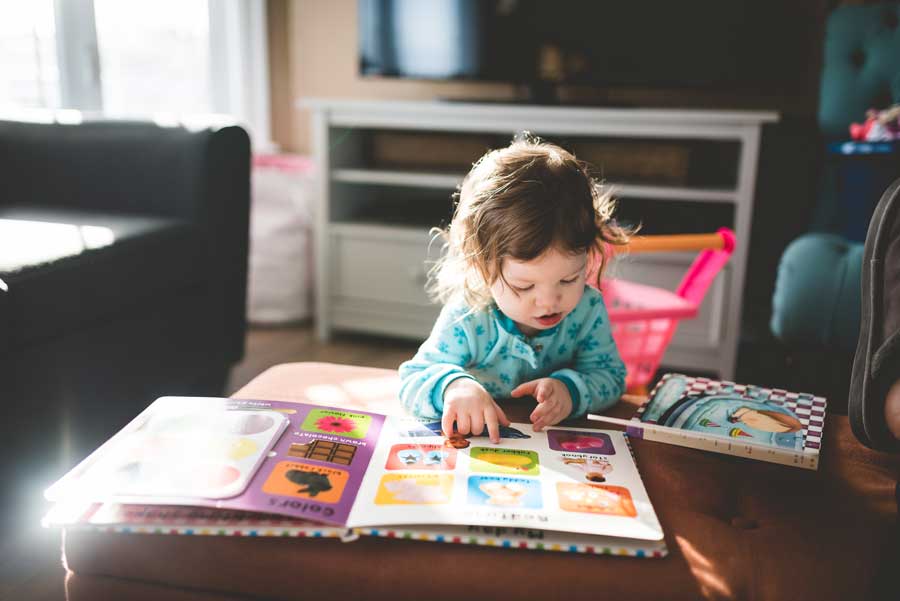 child reading a picture book - Glenn Doman