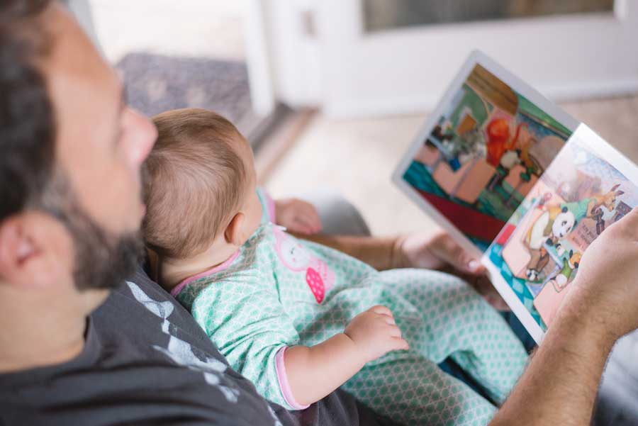 Father reading a book - langage development